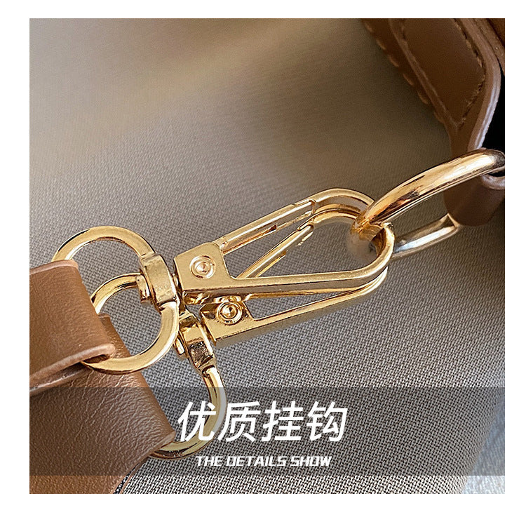 The Wave Silhouette Asymmetric Leather Saddle Bag