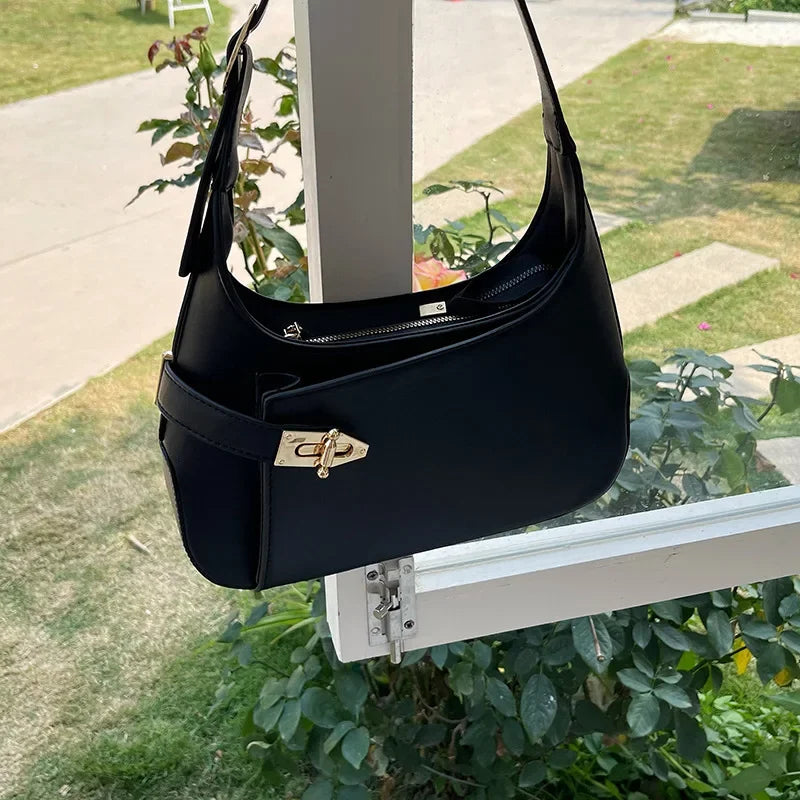 Minimalist Crescent Shoulder Bag with Buckle Accent and Adjustable Strap