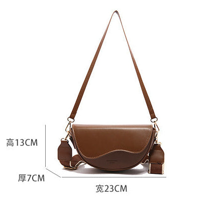 The Wave Silhouette Asymmetric Leather Saddle Bag