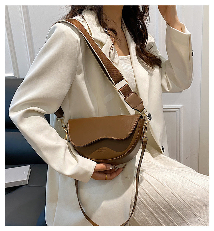 The Wave Silhouette Asymmetric Leather Saddle Bag