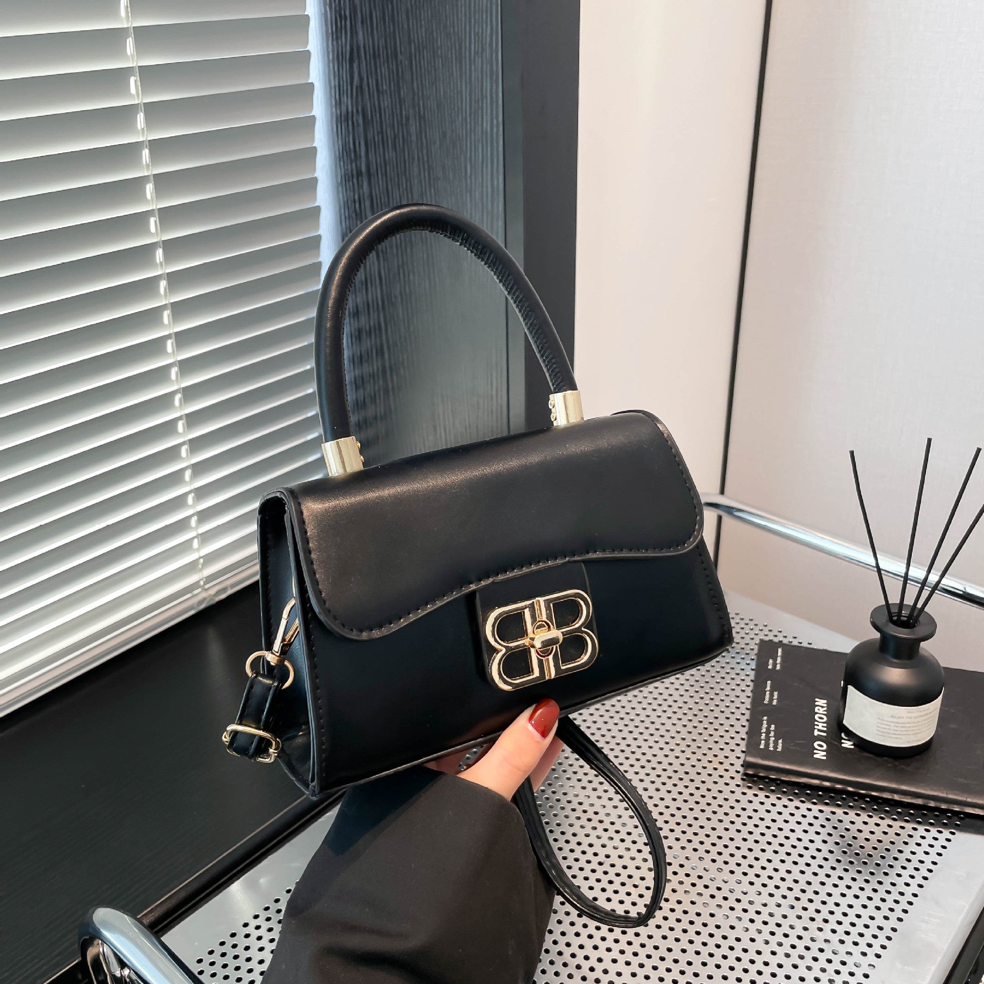 The Monogram Emblem Top-Handle Mini Bag
