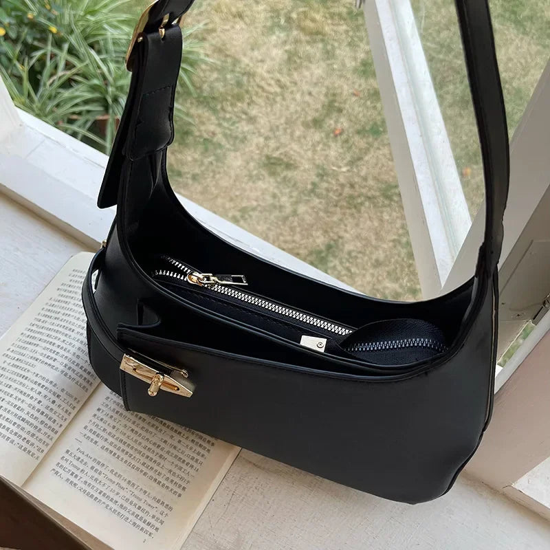 Minimalist Crescent Shoulder Bag with Buckle Accent and Adjustable Strap