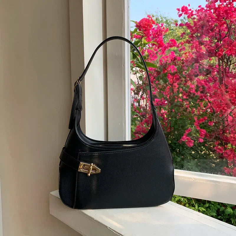 Minimalist Crescent Shoulder Bag with Buckle Accent and Adjustable Strap