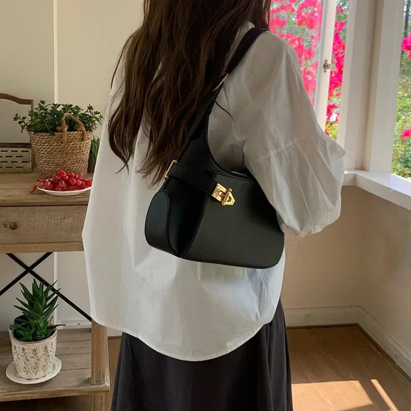 Minimalist Crescent Shoulder Bag with Buckle Accent and Adjustable Strap