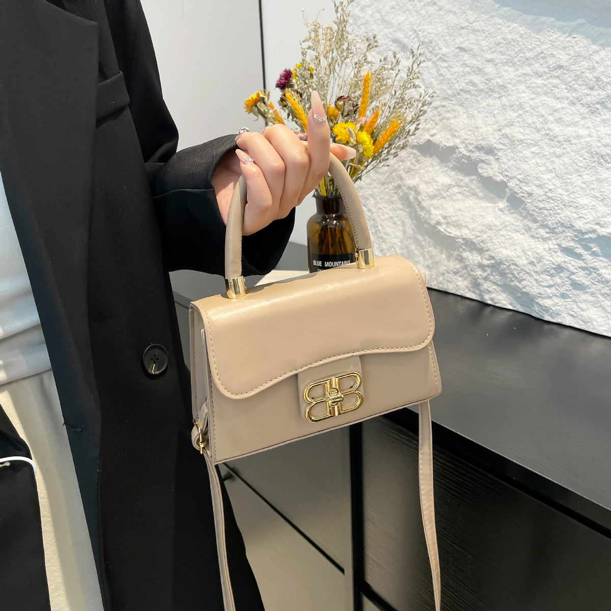 The Monogram Emblem Top-Handle Mini Bag