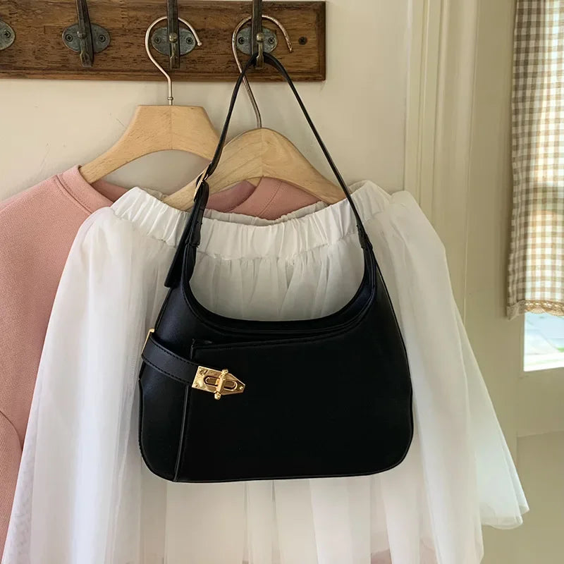 Minimalist Crescent Shoulder Bag with Buckle Accent and Adjustable Strap
