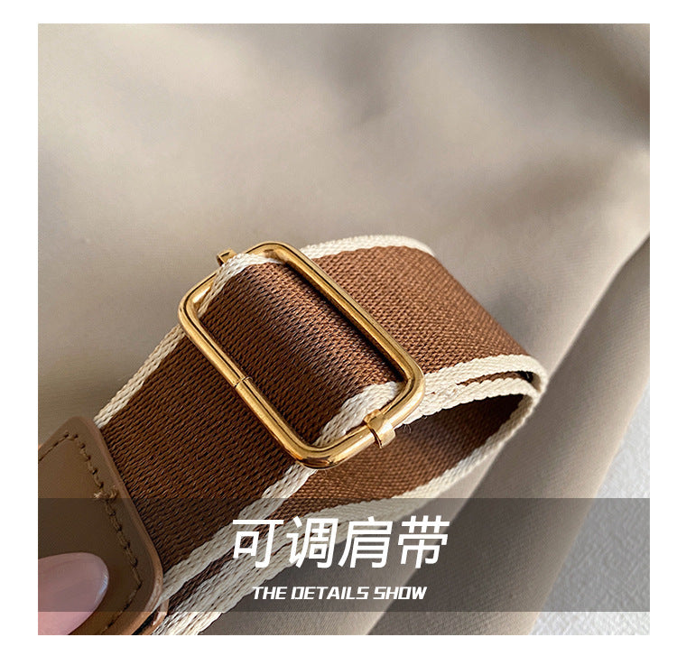 The Wave Silhouette Asymmetric Leather Saddle Bag