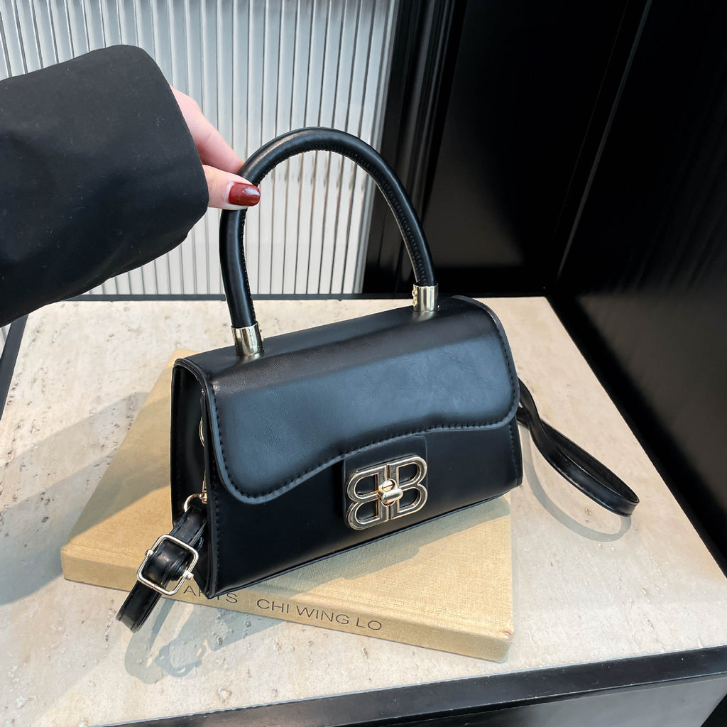 The Monogram Emblem Top-Handle Mini Bag