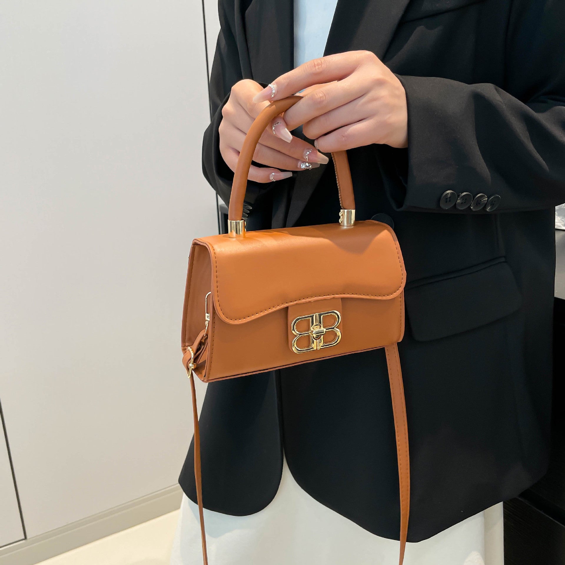 The Monogram Emblem Top-Handle Mini Bag